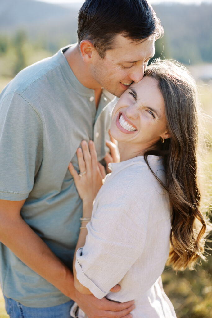 Joyful couple at Brainard Lake during golden-hour mountain photos