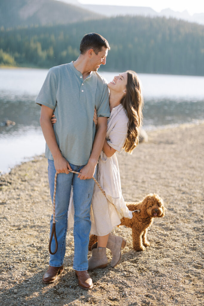 Couple laughing on the shore of Land Brainard Engagement Session