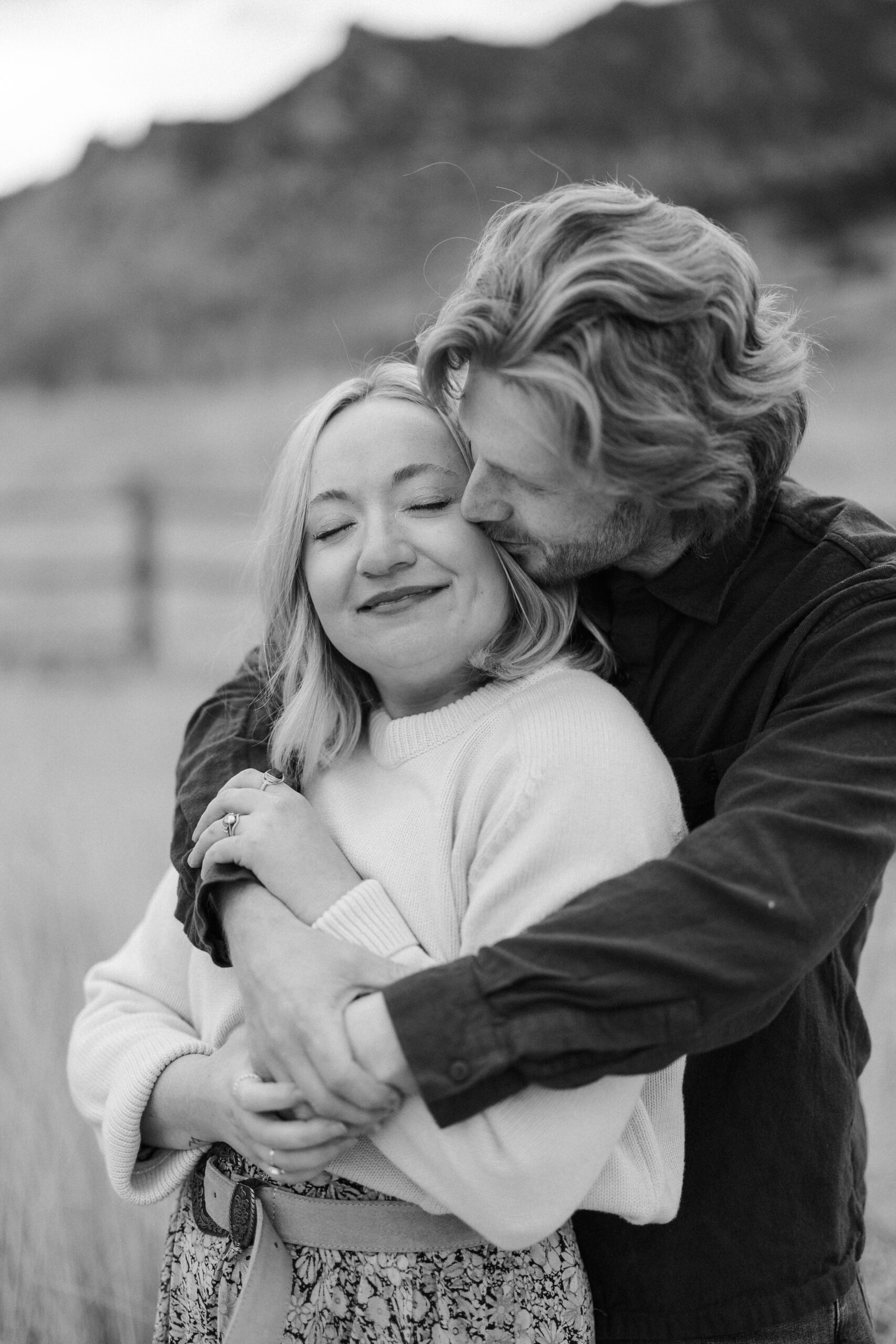 Couple embracing at south mesa trailhead colorado